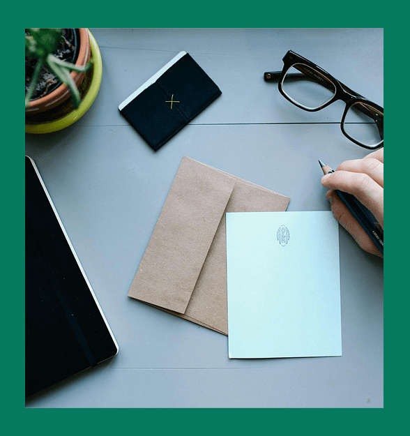 Workspace with notebook and glasses